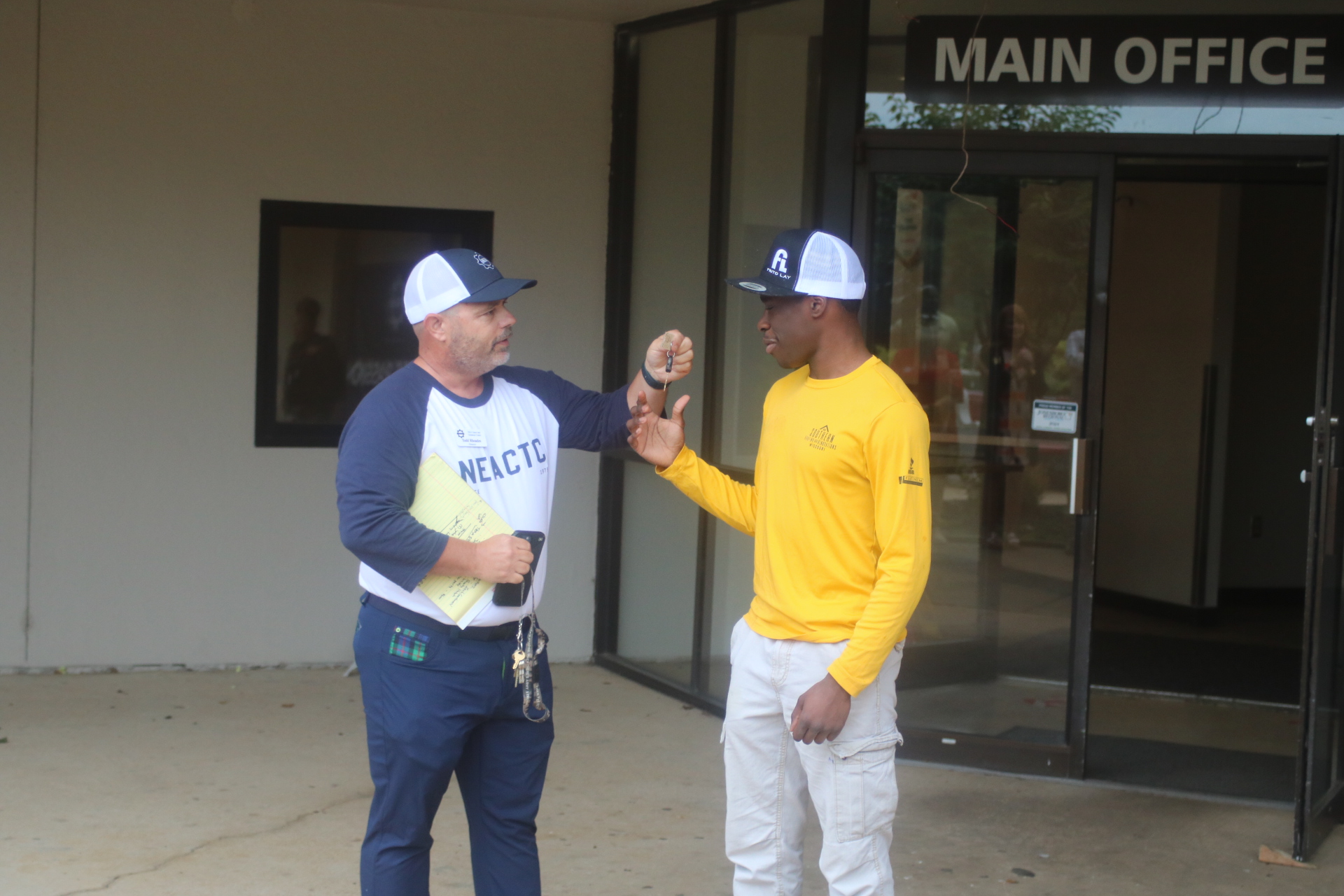 NEACTC director Todd Rhoades presents Gantt with the keys to the car.