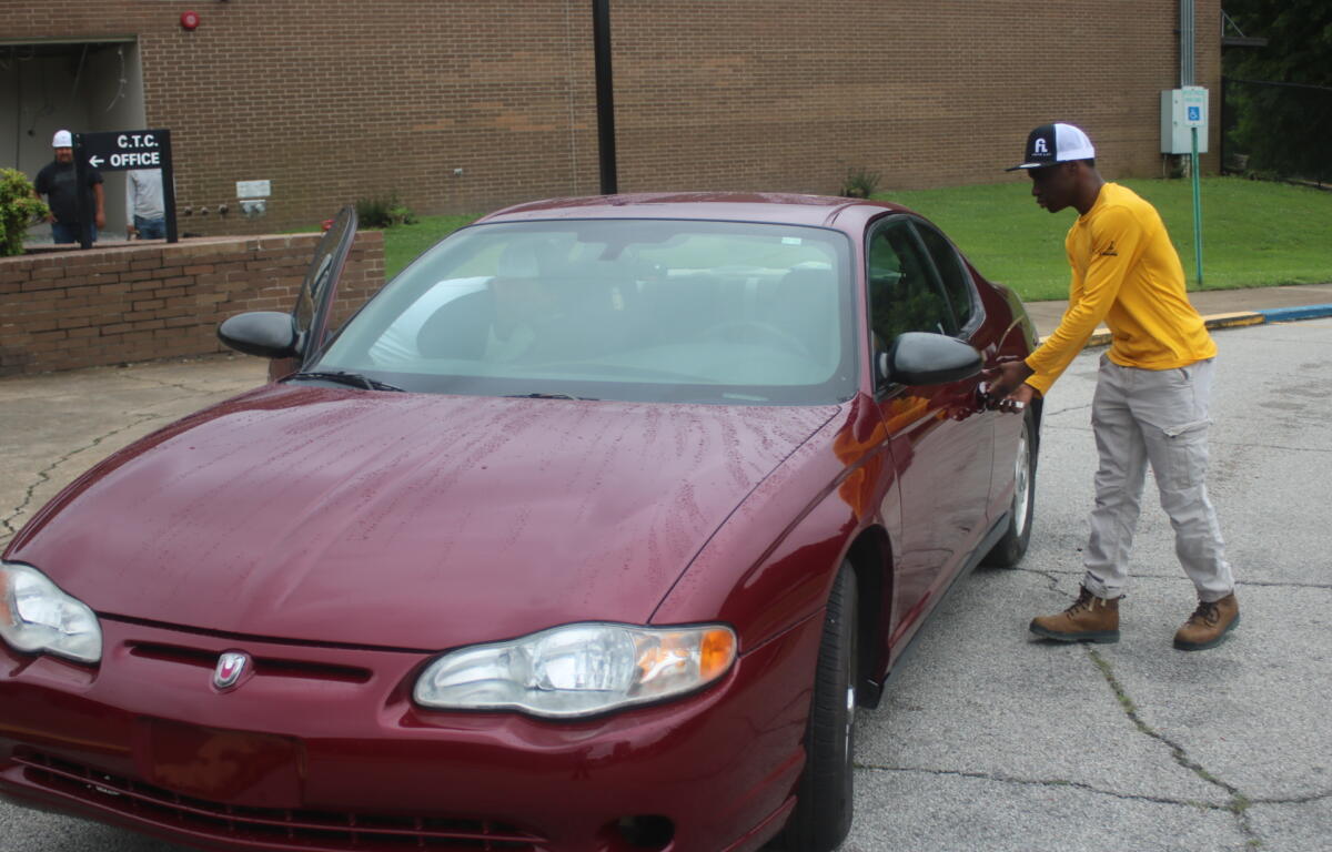 Quentin Gantt opens his newly restored car.