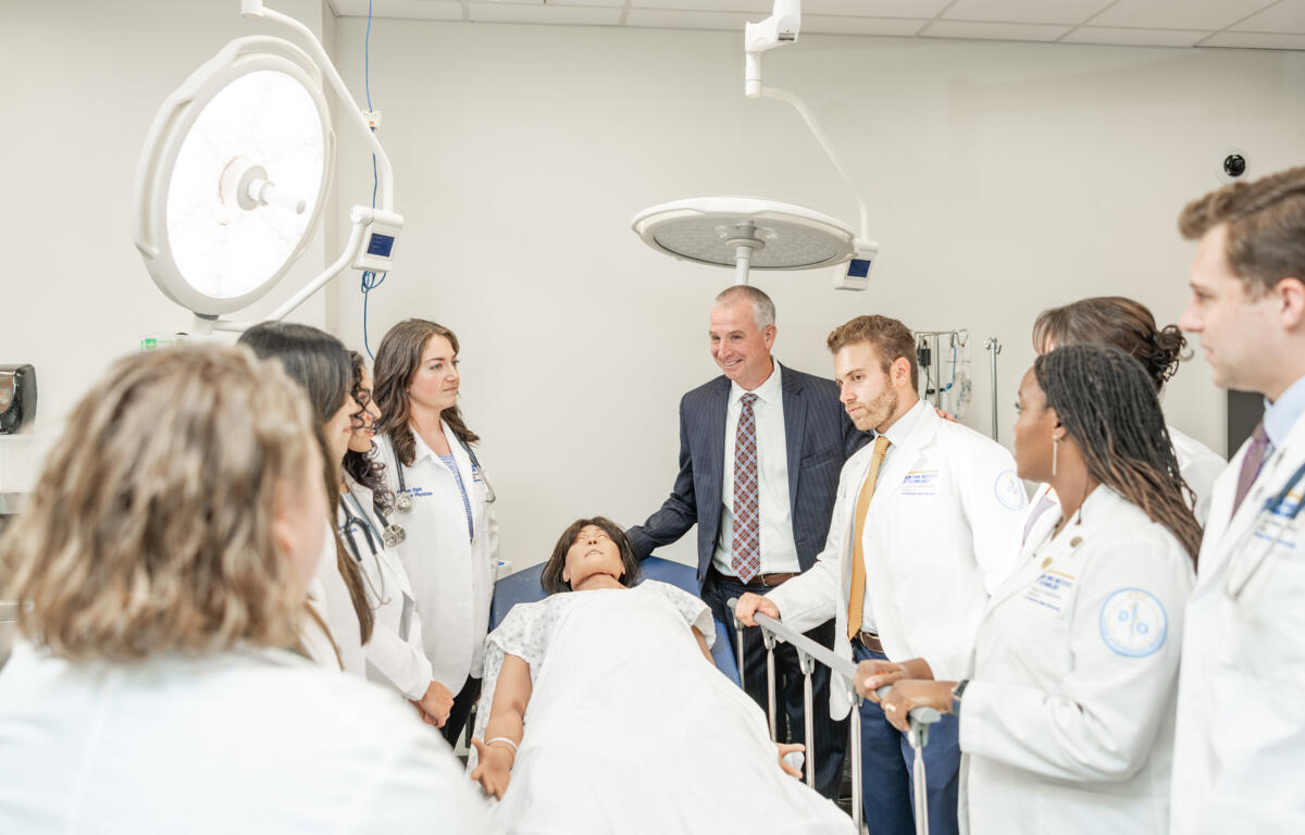 Dr. Shane Speights (center), dean of New York Institute of Technology College of Osteopathic Medicine at Arkansas State University, teaches medical students in the school’s simulation lab. A recent report showed that the Jonesboro-based medical school generated an estimated $44.6 million in economic impact during the 2022-23 fiscal year.