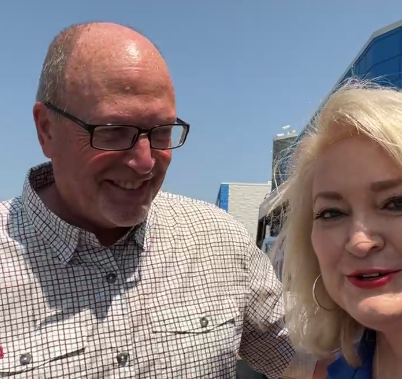 Jonesboro Mayor Harold Copenhaver with KAIT's Diana Davis at Stuff the Bus