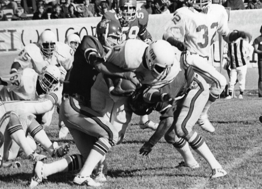 John Lorick, a defensive back on the 1975 undefeated Arkansas State University football team, makes a tackle. ASU celebrates the undefeated team this Saturday at the Texas State game.
