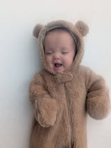 Baby in teddy bear onesie