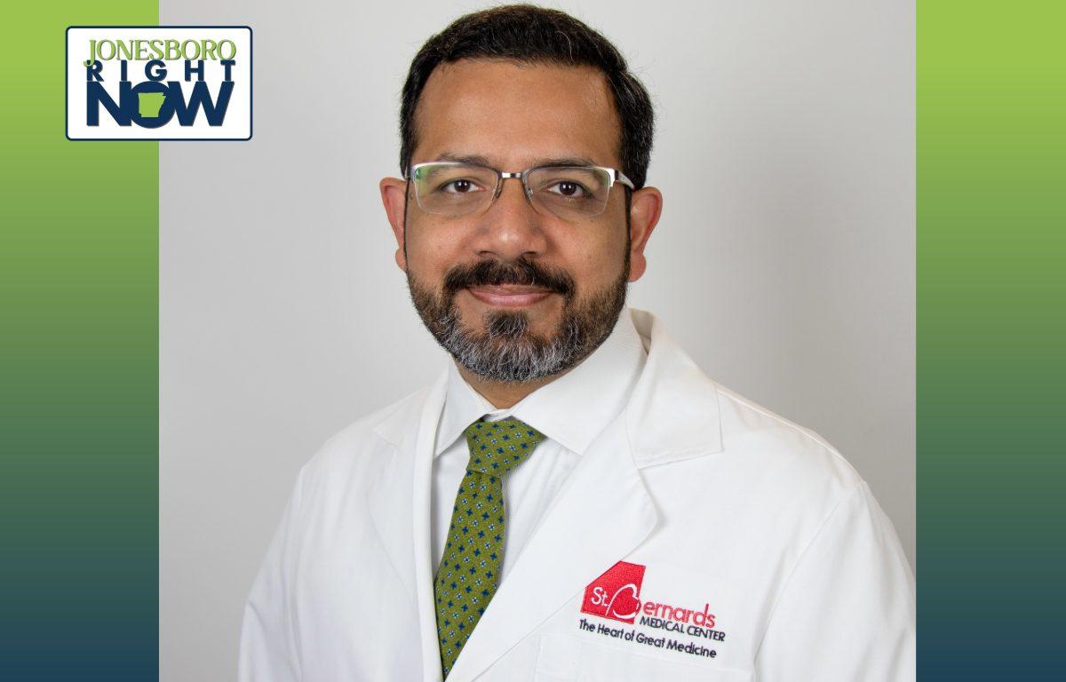 professional image of man in lab coat with glasses and beard. The lab coat says St Bernards medical center