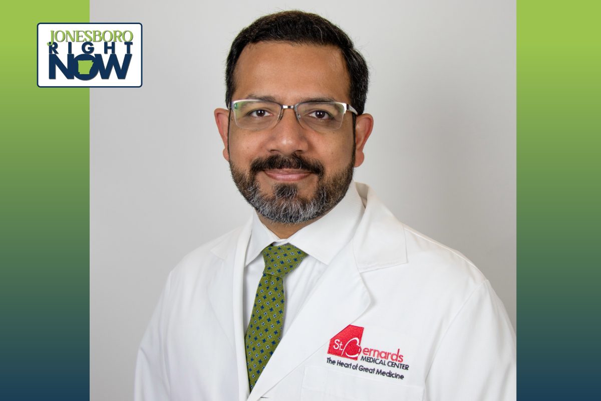 professional image of man in lab coat with glasses and beard. The lab coat says St Bernards medical center