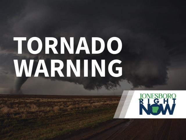 tornado on flat land with tornado warning in foreground