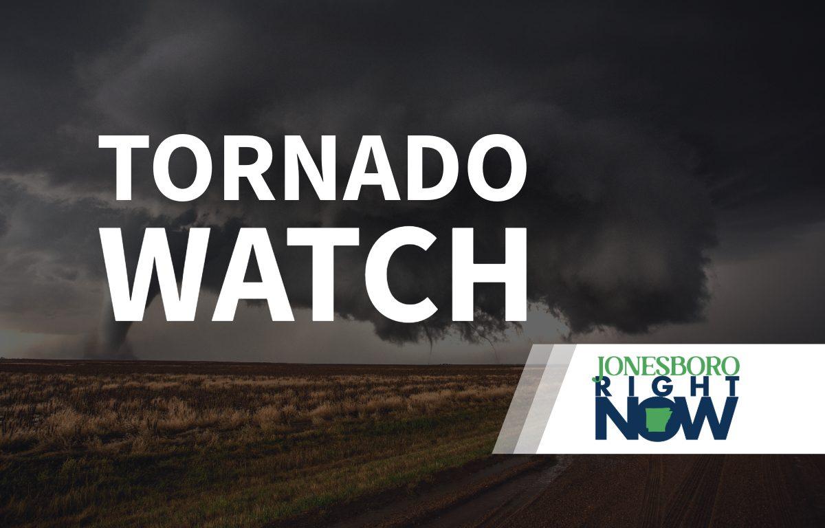 tornado on flat land with tornado watch text in foreground