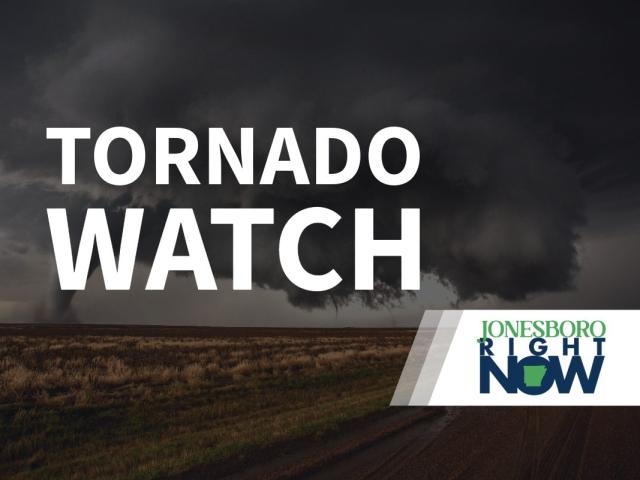 tornado on flat land with tornado watch text in foreground