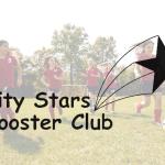 girls playing soccer in red uniforms with city stars booster club