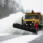 yellow snow plow clearing roads