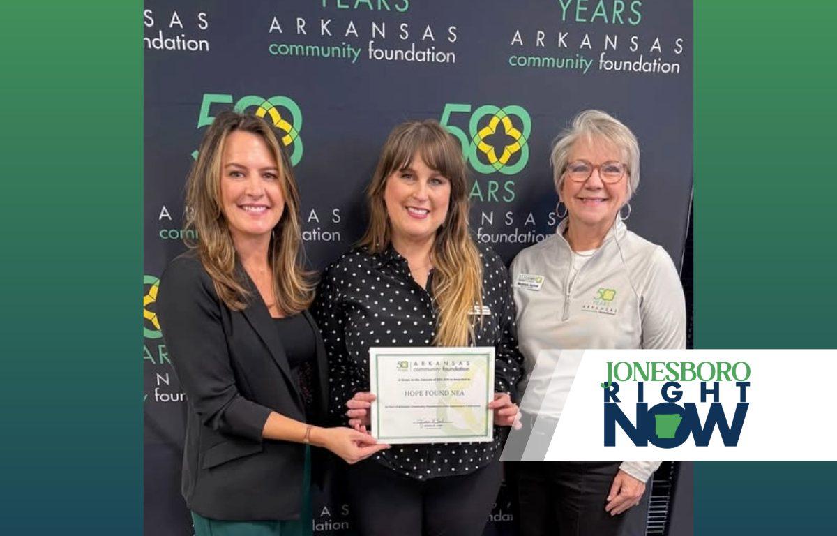 three women representing Hope Found hold a certificate