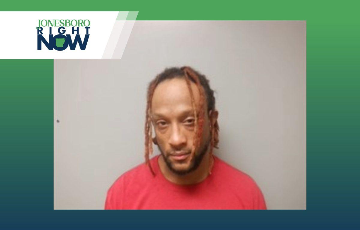 mug shot of marshall irvin williams, man with dreadlocks and red shirt