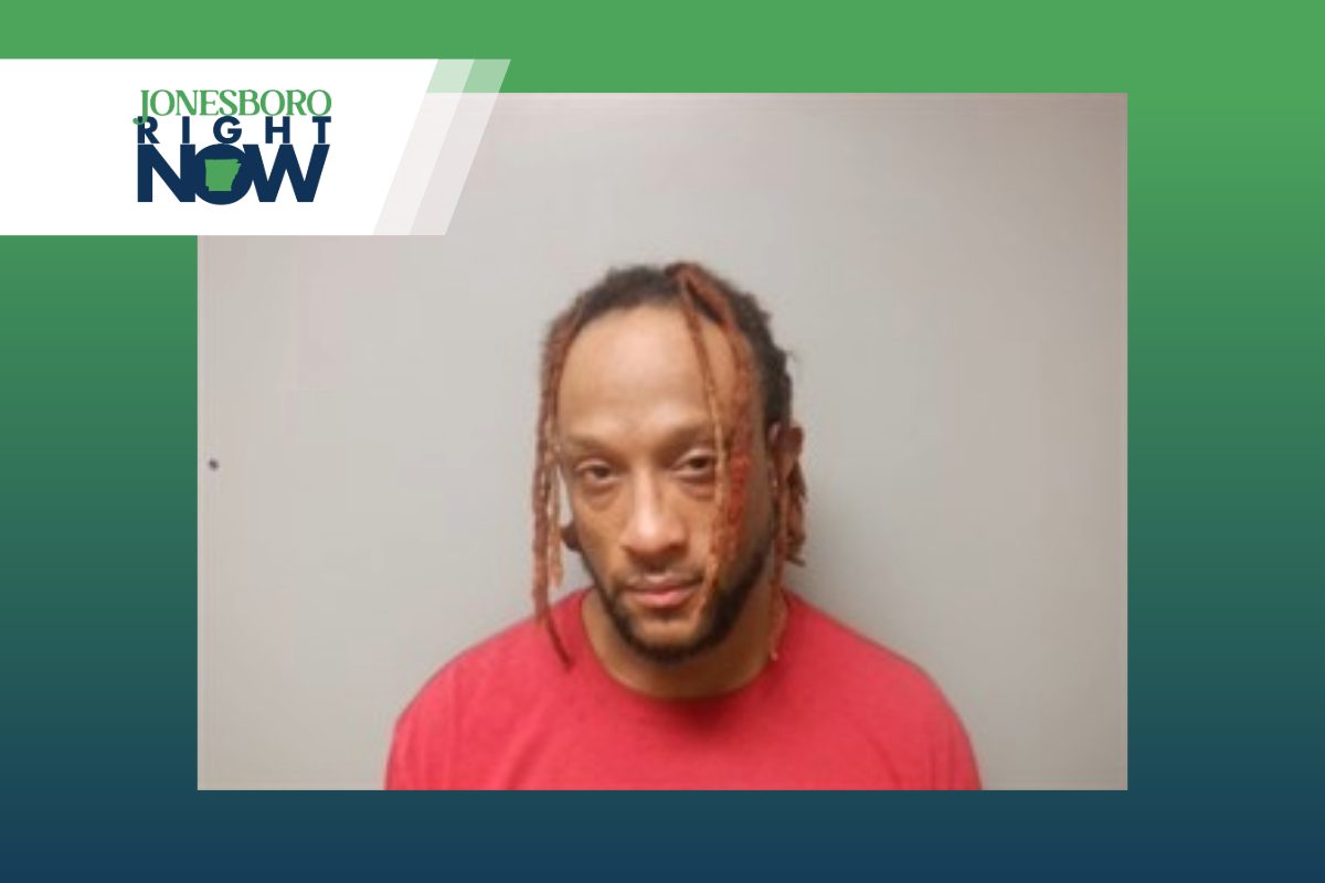 mug shot of marshall irvin williams, man with dreadlocks and red shirt