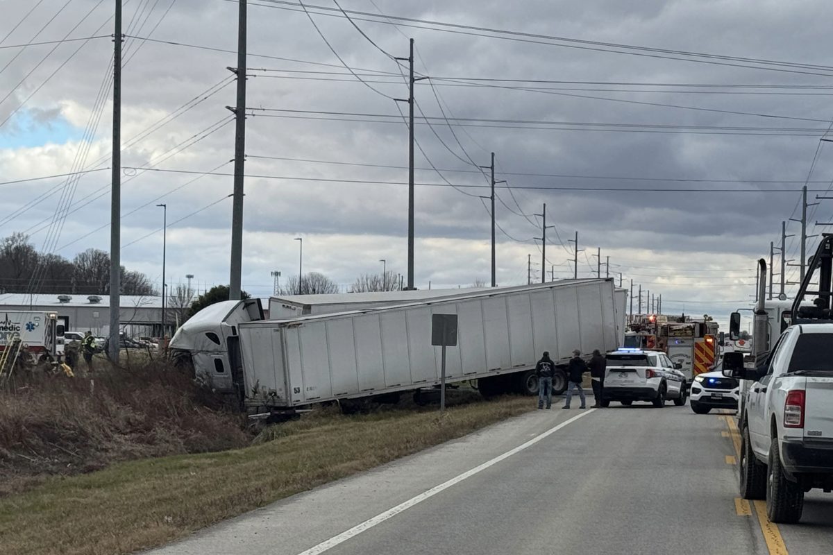 two semi trucks in ditch