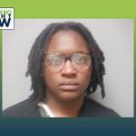 mug shot of african american woman with glasses
