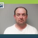 mug shot white man with white shirt phillip mink