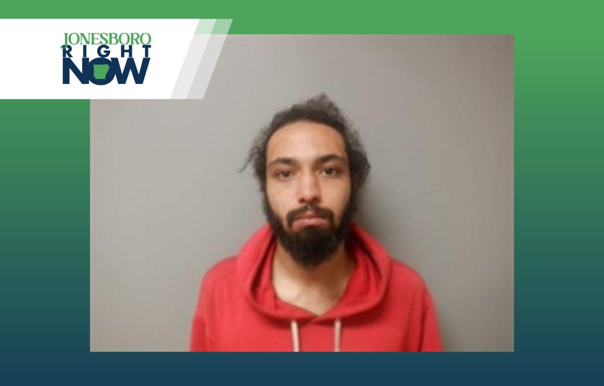 mug shot for trey haper, man with beard and mustach and red hoodie