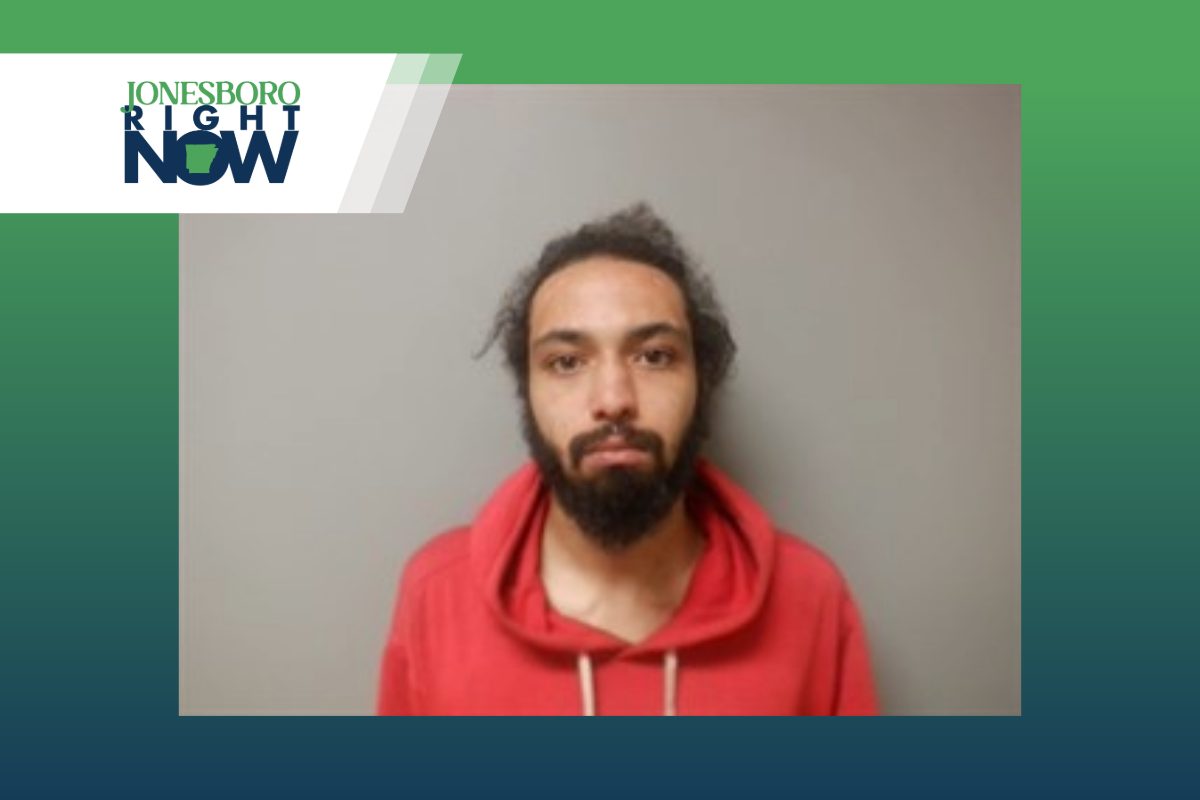 mug shot for trey haper, man with beard and mustach and red hoodie
