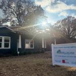 front of building with sign for Family Crisis Center in yard