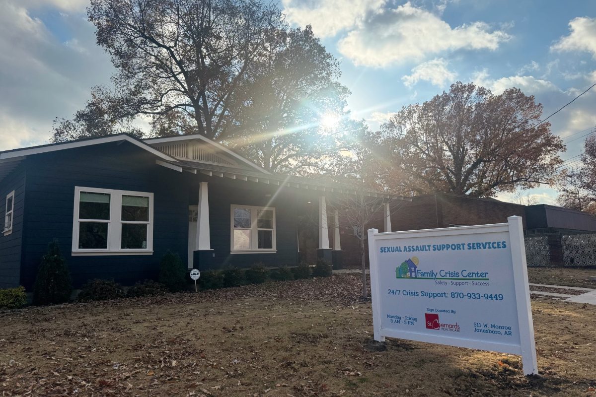 front of building with sign for Family Crisis Center in yard