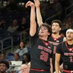 three basketball players