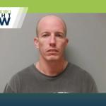 mug shot of bald man