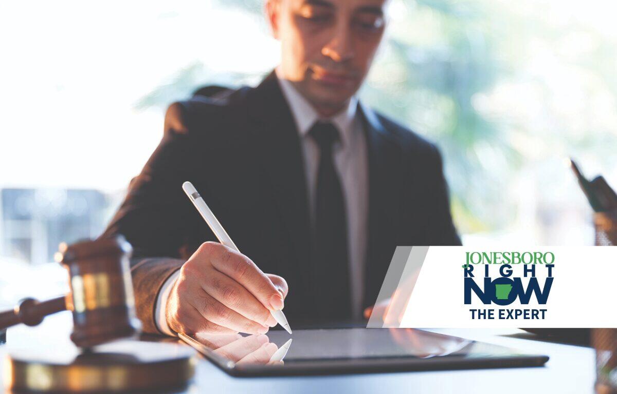 Attorney writingon ipad