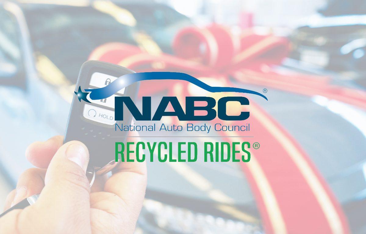 National auto body council logo in front of car with bow on it