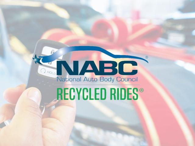 National auto body council logo in front of car with bow on it