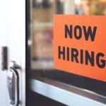 now hiring sign on door
