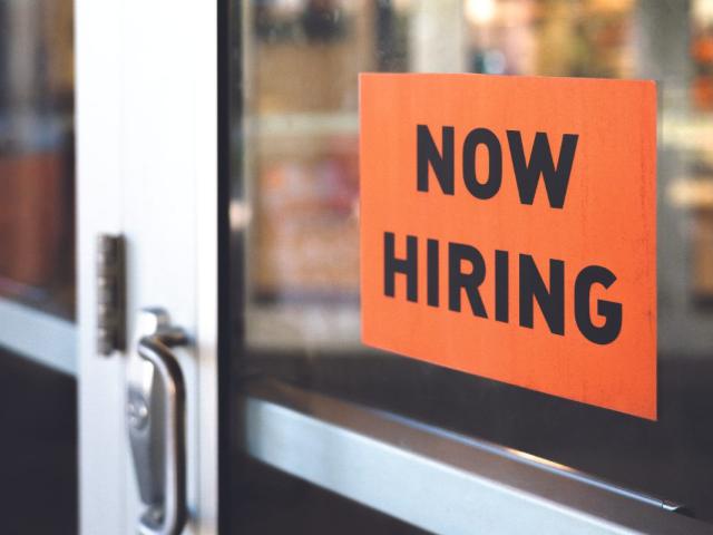 now hiring sign on door