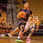 woman playing basketball in a-state uniform, player