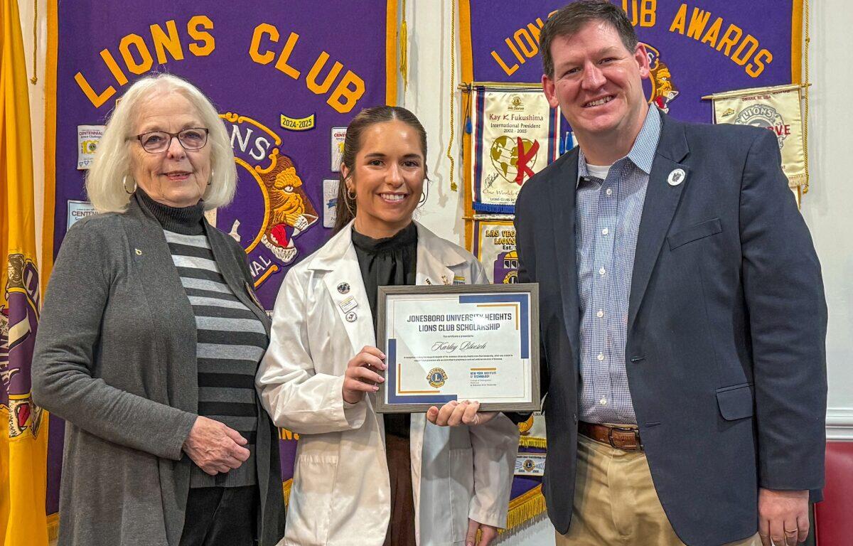 onesboro University Heights Lions Club First Vice President Deborah Levins (left) presents NYITCOM Student Doctor Karley Bloesch with a certificate recognizing her as the recipient of a newly-established scholarship the JUH Lions Club created to annually support an NYITCOM medical student. Joining Levins and Bloesch is Casey Pearce (far right), Director of External Relations for NYITCOM at A-State.