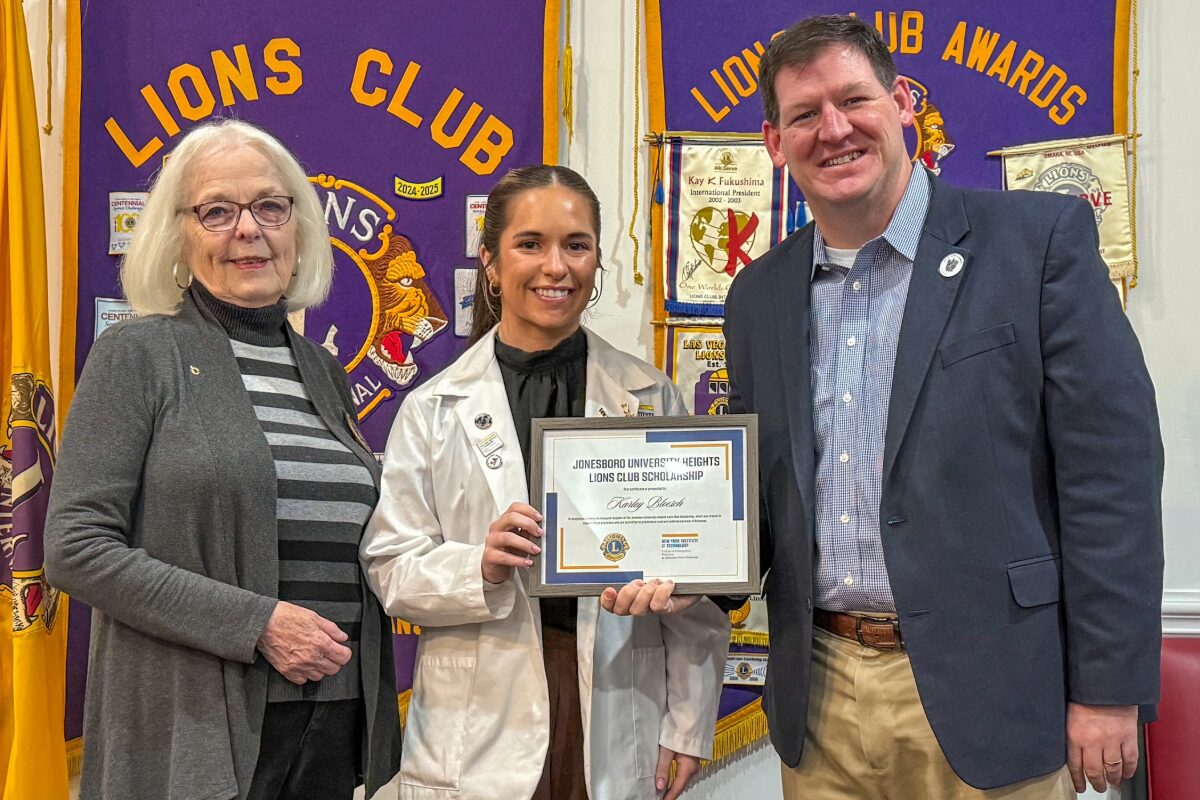 onesboro University Heights Lions Club First Vice President Deborah Levins (left) presents NYITCOM Student Doctor Karley Bloesch with a certificate recognizing her as the recipient of a newly-established scholarship the JUH Lions Club created to annually support an NYITCOM medical student. Joining Levins and Bloesch is Casey Pearce (far right), Director of External Relations for NYITCOM at A-State.