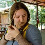 Cutler holding a snake during her trip to Peru.