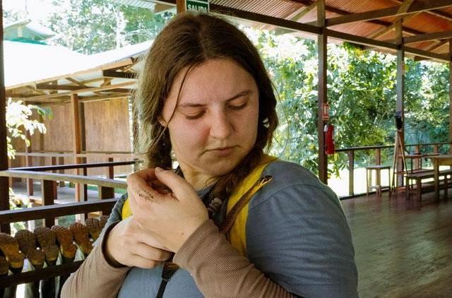 Cutler holding a snake during her trip to Peru.