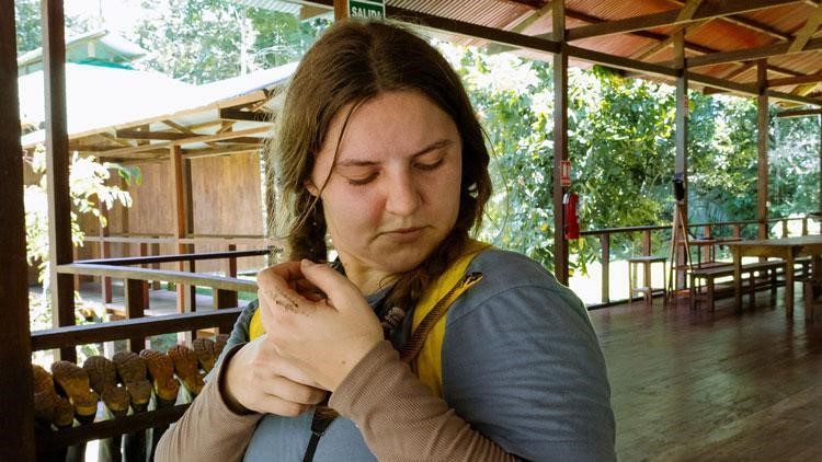 Cutler holding a snake during her trip to Peru.