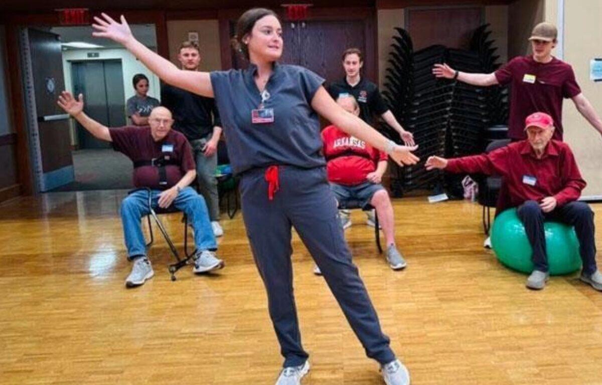 Occupational therapy student working with clients.