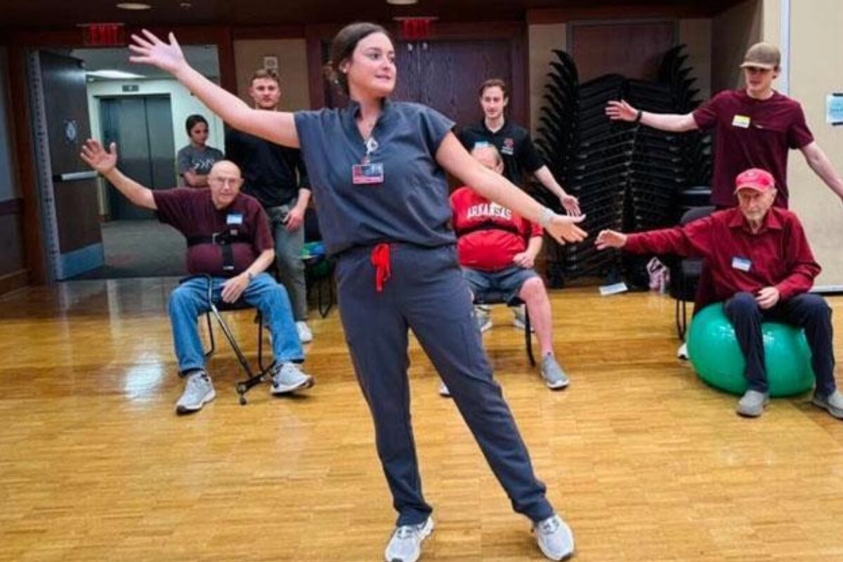 Occupational therapy student working with clients.