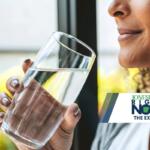 The Expert woman holding glass of clean water