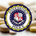 Jonesboro Police Department seal over a blurred background of scattered pills.