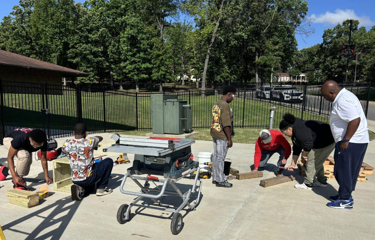 students and adults participate in hands on skill learning