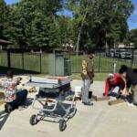 students and adults participate in hands on skill learning