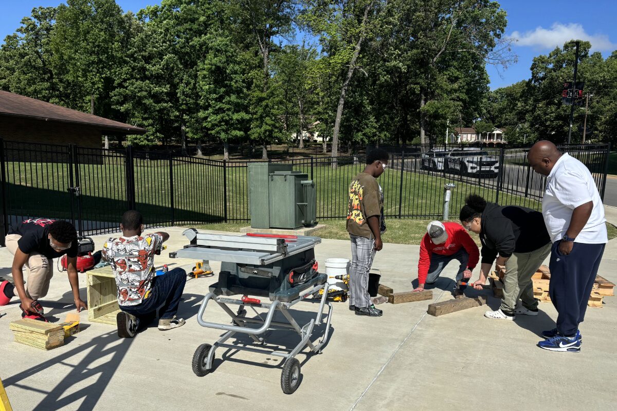 students and adults participate in hands on skill learning