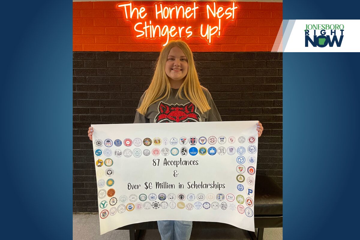 blonde girl from harrisburg holds poster showing college acceptance