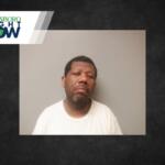 Mugshot-style photo of a man in a white T-shirt against a gray wall, used in a Jonesboro Right Now news banner.