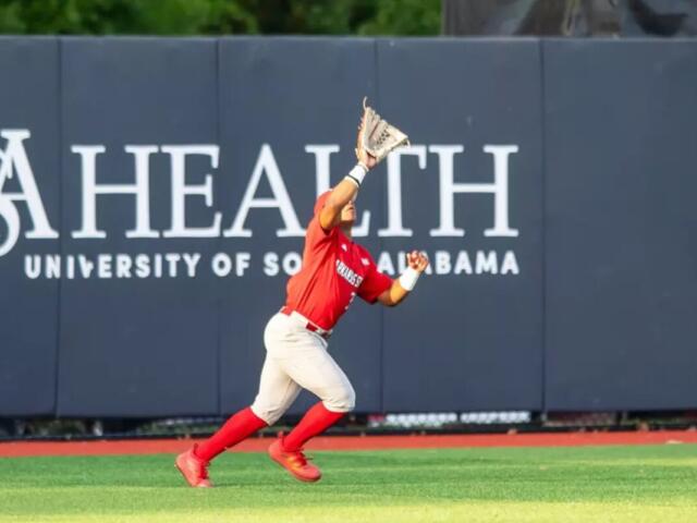 AState Baseball player catching ball at USA