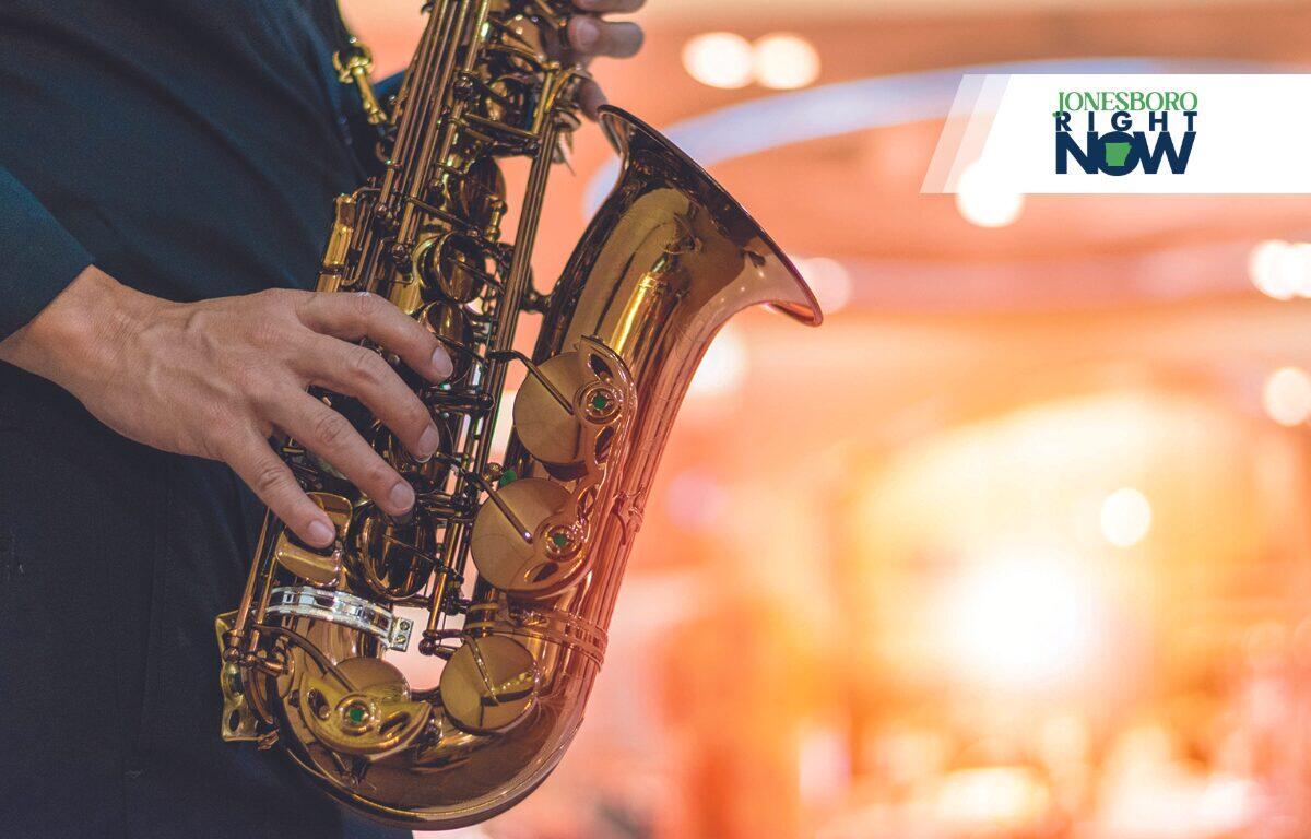 hands and saxaphone JRN Logo