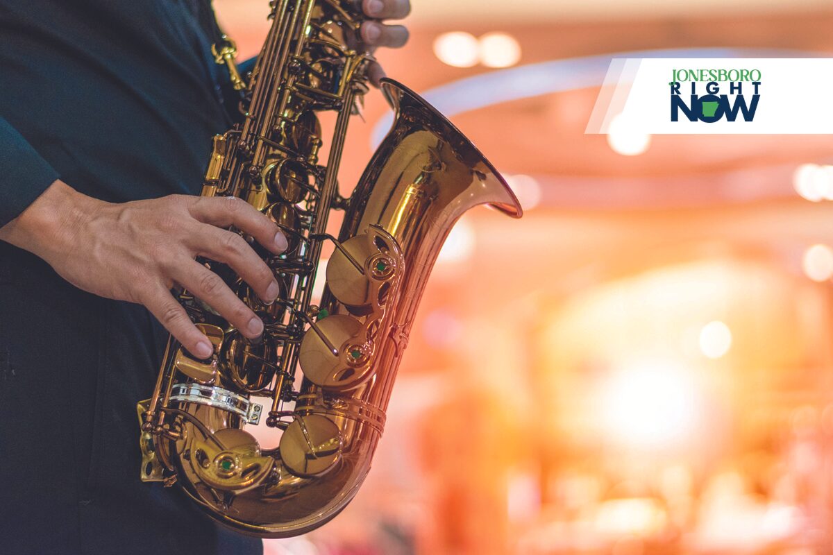 hands and saxaphone JRN Logo