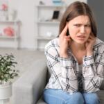 woman on couch loud noise