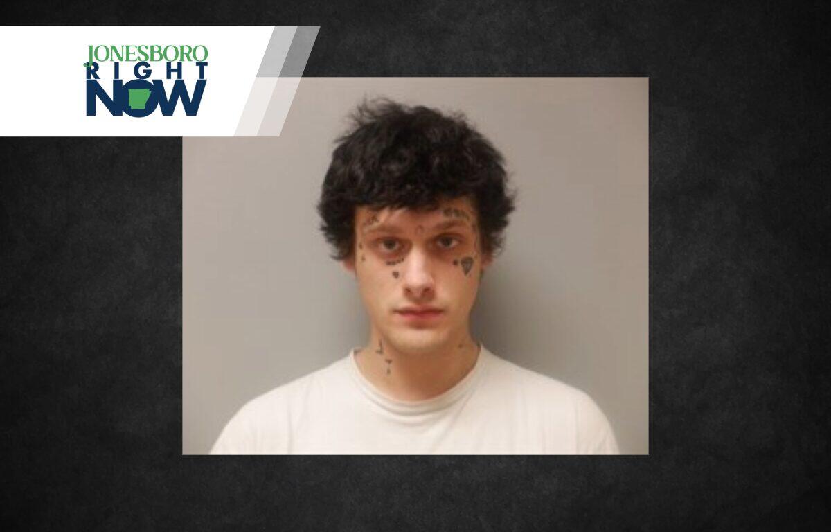 Mugshot-style photo of a young man with facial tattoos against a gray background, with a Jonesboro Right Now banner in the top-left corner.